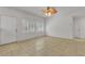 Inviting living room featuring tiled floor, window shutters, and natural light at 6407 Wild Strawberry Ln, Las Vegas, NV 89142
