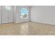 Living Room showcases tile flooring, front door and views of the yard at 6407 Wild Strawberry Ln, Las Vegas, NV 89142