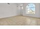 Neutral Living Room offers tile flooring, large windows and natural light at 6407 Wild Strawberry Ln, Las Vegas, NV 89142