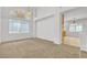 Living Room featuring carpet, front windows and lots of natural light at 6407 Wild Strawberry Ln, Las Vegas, NV 89142