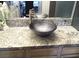 Contemporary bathroom vanity with a unique vessel sink and granite countertop at 6480 Annie Oakley Dr # 111, Las Vegas, NV 89120