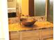 Bathroom vanity with vessel sink and granite countertop at 6480 Annie Oakley Dr # 111, Las Vegas, NV 89120