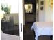 Inviting bedroom featuring stylish decor and an open doorway to the bathroom area at 6480 Annie Oakley Dr # 111, Las Vegas, NV 89120