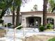 Inviting clubhouse entrance with well-manicured landscaping and easy access at 6480 Annie Oakley Dr # 111, Las Vegas, NV 89120