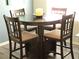 The breakfast bar table with seating provides an ideal spot for casual meals at 6480 Annie Oakley Dr # 111, Las Vegas, NV 89120