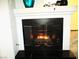 Elegant fireplace with a modern design creating a warm and inviting focal point at 6480 Annie Oakley Dr # 111, Las Vegas, NV 89120