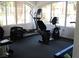 Bright gym with elliptical and stationary bike overlooking the community at 6480 Annie Oakley Dr # 111, Las Vegas, NV 89120