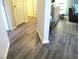 Hallway featuring modern flooring that leads to the living room at 6480 Annie Oakley Dr # 111, Las Vegas, NV 89120
