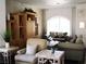 Inviting living room with plush seating, decorative shelving, and plenty of natural light at 6480 Annie Oakley Dr # 111, Las Vegas, NV 89120