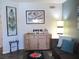 Comfortable living room featuring modern decor and a stylish sideboard cabinet at 6480 Annie Oakley Dr # 111, Las Vegas, NV 89120