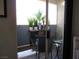 Outdoor patio with seating and potted plants at 6480 Annie Oakley Dr # 111, Las Vegas, NV 89120
