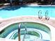 Community pool featuring a hot tub and ample space for relaxation and recreation at 6480 Annie Oakley Dr # 111, Las Vegas, NV 89120