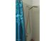 Close-up of a shower with a blue shower curtain and an adjustable shower head at 6480 Annie Oakley Dr # 111, Las Vegas, NV 89120