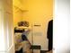 Cluttered walk-in closet with shelving, storage containers, and hanging clothes at 6480 Annie Oakley Dr # 111, Las Vegas, NV 89120