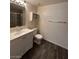 Bathroom features a vanity with storage, a toilet, and a shower/tub combo at 6749 Charleston Blvd # 3, Las Vegas, NV 89146