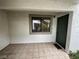 The tiled entryway leads to a dark-green front door and a window, providing a welcoming space at 6749 W Charleston Blvd # 2, Las Vegas, NV 89146