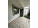 A tiled entryway with a dark-green door and a window showcases a clean and inviting entrance at 6749 W Charleston Blvd # 2, Las Vegas, NV 89146