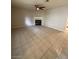 The living room boasts tile floors, a ceiling fan, and a fireplace, offering a comfortable living space at 6749 W Charleston Blvd # 2, Las Vegas, NV 89146