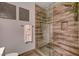 Updated bathroom featuring a glass-enclosed shower and decorative tile work at 708 Canterbury Cross Pl, Las Vegas, NV 89144