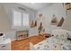A bedroom featuring a woodland theme, hardwood floors and natural light at 708 Canterbury Cross Pl, Las Vegas, NV 89144