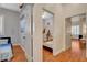 Bright bedroom with hardwood floors and white trim showcases a cozy and inviting space at 708 Canterbury Cross Pl, Las Vegas, NV 89144