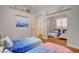 bedroom showcasing two beds, closet with mirror, and wood flooring at 708 Canterbury Cross Pl, Las Vegas, NV 89144