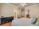 A cozy bedroom featuring hardwood floors, dresser, and mirrors for extra light at 708 Canterbury Cross Pl, Las Vegas, NV 89144
