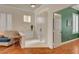 Welcoming foyer with white-tile flooring, a storage cabinet, and bright natural light at 708 Canterbury Cross Pl, Las Vegas, NV 89144