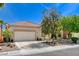 Charming single-story home featuring a two car garage, desert landscaping, and an inviting front porch at 708 Canterbury Cross Pl, Las Vegas, NV 89144