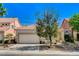 Lovely single-story home featuring a two car garage, desert landscaping, and a welcoming front porch at 708 Canterbury Cross Pl, Las Vegas, NV 89144