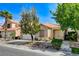 Charming single-story home featuring a well-manicured front yard, desert landscaping, and an inviting front porch at 708 Canterbury Cross Pl, Las Vegas, NV 89144