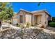 Lovely single-story home featuring desert landscaping, and a welcoming front porch at 708 Canterbury Cross Pl, Las Vegas, NV 89144
