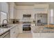 Well-equipped kitchen featuring stainless steel appliances, granite countertops, and ample cabinet space at 708 Canterbury Cross Pl, Las Vegas, NV 89144