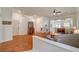 Open living space featuring hardwood floors and a view of the kitchen and dining area at 708 Canterbury Cross Pl, Las Vegas, NV 89144
