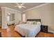 Spacious primary bedroom features hardwood floors, neutral walls, plantation shutters and a mirrored closet at 708 Canterbury Cross Pl, Las Vegas, NV 89144