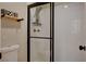 Modern tiled standing shower stall with glass door and shelving for toiletries at 708 Canterbury Cross Pl, Las Vegas, NV 89144