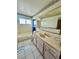 Bright bathroom featuring a tub, tiled floors, vanity, and ample storage space at 7200 Alta Dr, Las Vegas, NV 89145