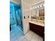 Cozy bathroom featuring a vanity, shower, and light fixtures at 7200 Alta Dr, Las Vegas, NV 89145