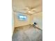 Cozy bedroom with a ceiling fan, window view, and simple design for easy living at 7200 Alta Dr, Las Vegas, NV 89145