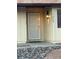 Close-up of a charming entrance featuring a decorative security door and exterior light fixture at 7200 Alta Dr, Las Vegas, NV 89145