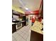 Functional kitchen features stainless steel appliances, tile floors, and tile countertops at 7200 Alta Dr, Las Vegas, NV 89145