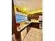 Galley kitchen features updated cabinetry and tile flooring at 7200 Alta Dr, Las Vegas, NV 89145