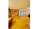 Open living room featuring hardwood floors, a decorative fireplace, and natural light at 7200 Alta Dr, Las Vegas, NV 89145
