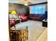 Living area featuring wood paneled walls and comfortable seating at 7200 Alta Dr, Las Vegas, NV 89145