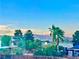 Scenic view featuring a lush backyard with palm trees and mountain backdrop at 7200 Alta Dr, Las Vegas, NV 89145