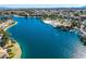 Picturesque lake community with waterfront homes, lush greenery, and serene water views at 7632 Spruce Run Ct, Las Vegas, NV 89128