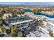 Aerial view of the lake community showcases vibrant landscaping and convenient parking at 7632 Spruce Run Ct, Las Vegas, NV 89128