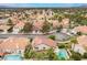 Bird's eye view showcasing a residential area with mature trees and well-maintained homes at 7632 Spruce Run Ct, Las Vegas, NV 89128