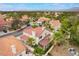 A beautiful home featuring a terracotta roof, a well-maintained yard, and lush trees surrounding the property at 7632 Spruce Run Ct, Las Vegas, NV 89128