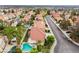 Aerial image shows homes in a planned community neighborhood, featuring mature trees at 7632 Spruce Run Ct, Las Vegas, NV 89128